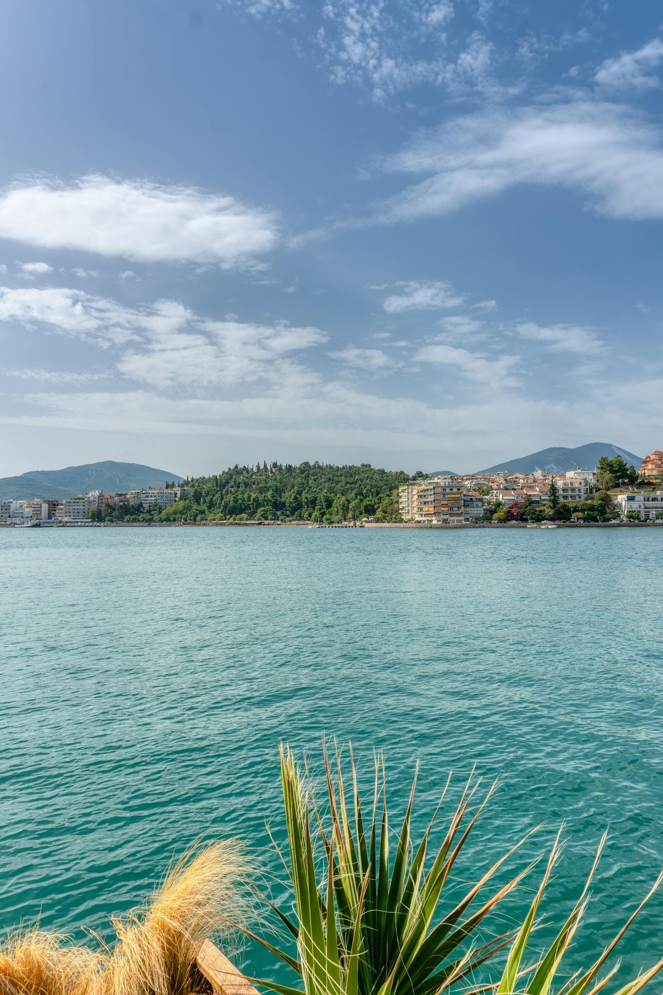 Stunning seascape in Χαλκίδα, Greece, featuring serene waters and lush countryside.